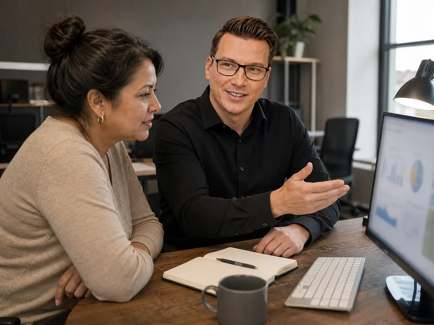 Matt explaining a performance report to a client